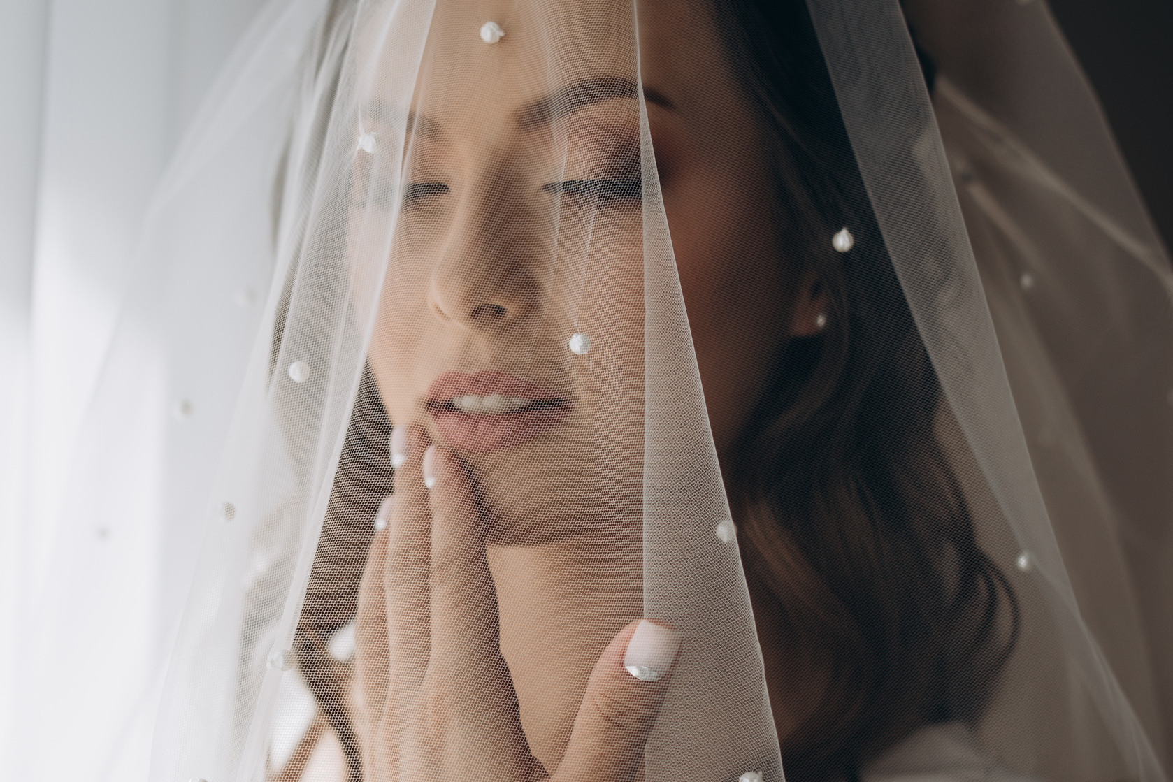 Pretty Bride with a Stylish Veil over Her Face